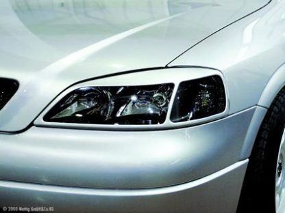 Kryty předních světel Opel Astra G